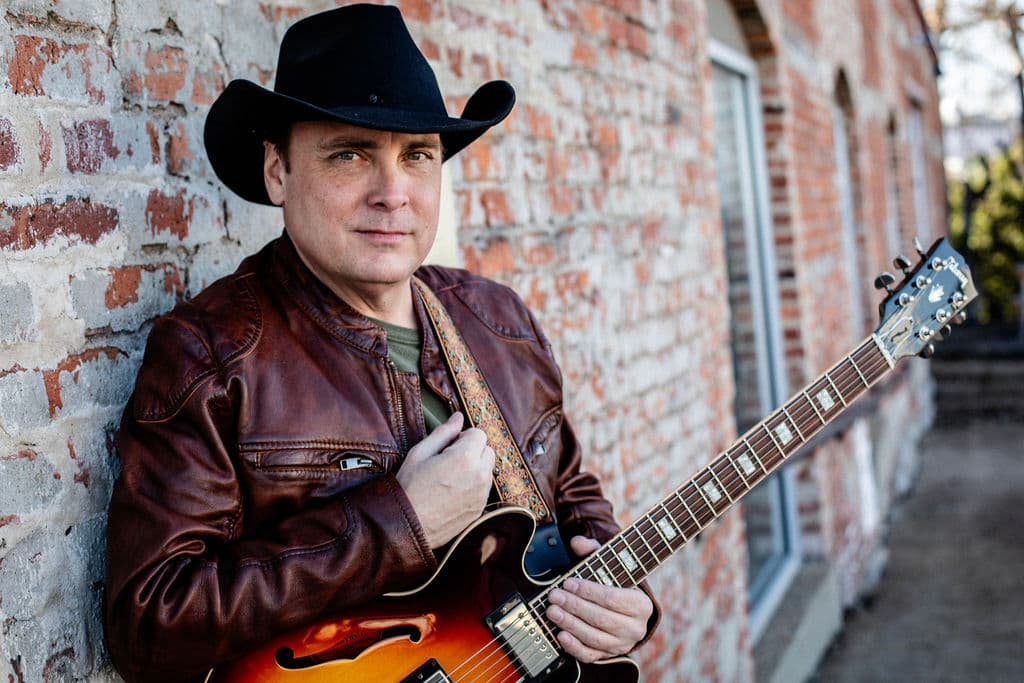 Bo Adams with guitar